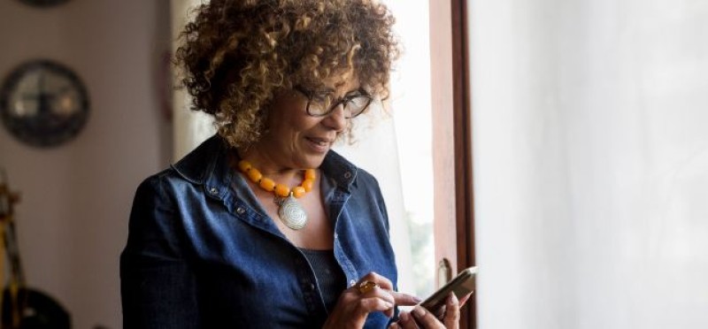 A woman looking at her phone
